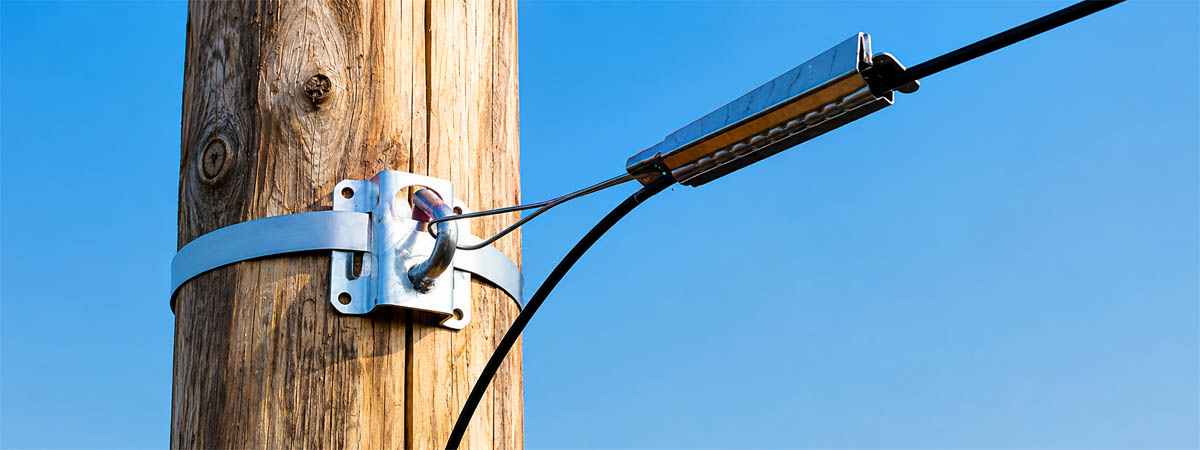 Drop wire clamp on a utility pole