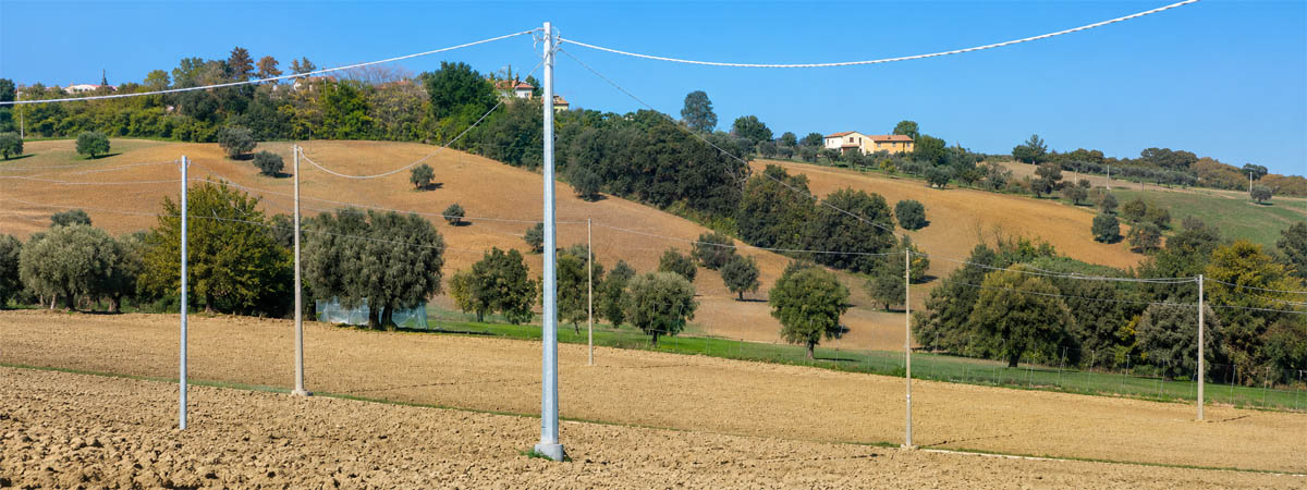 A steel utility pole in the rural fields.